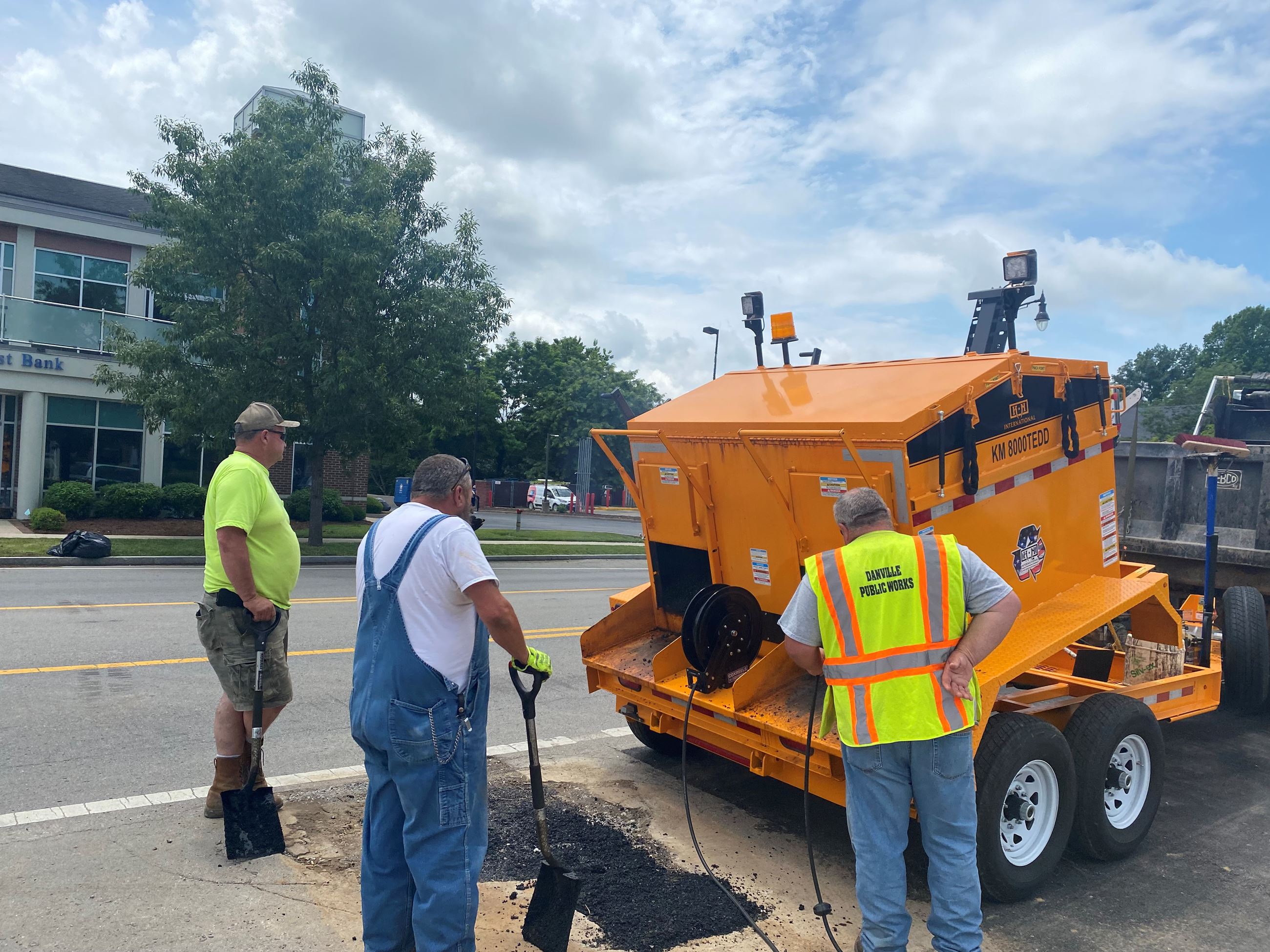 Public Works Employees Patching Asphalt