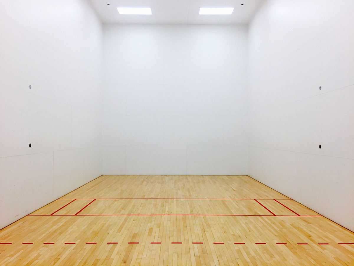 white wall with wood floor court